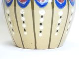 a vase that has a blue and white design on it