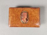 a close up of a wooden box with a picture of a woman on it