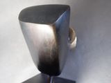 a metal object that is sitting on a stand