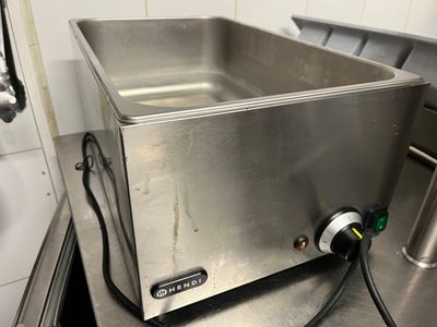 a stainless steel sink in a kitchen with a faucet