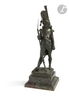bronze statue of a man on a horse with a sword