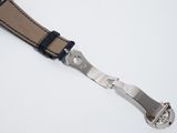 leather watch strap with silver buckle on a white background