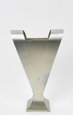 a silver vase with a metal base on a white background