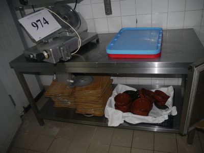 a metal table with a tray of food on top of it