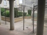 an empty courtyard with a lot of columns and a roof
