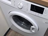 a washer and a dryer in a small room