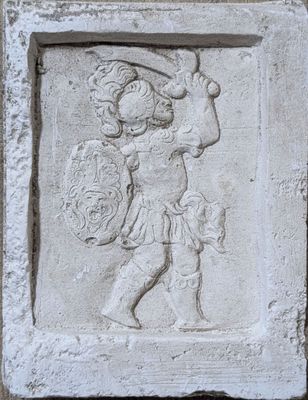 an image of a relief of a woman holding a shield and shield