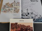 a picture of a book with a picture of a city in it