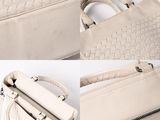 two pictures of a white bag with a handle