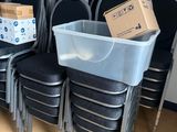 a stack of chairs with boxes on top of them