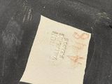 a piece of paper that has been left on the floor