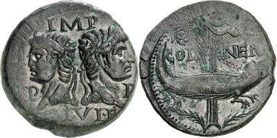a silver coin with a woman and a man on it