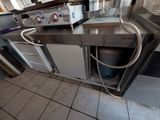 an image of a commercial kitchen with stainless steel appliances