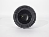 a close up of a camera lens on a white surface