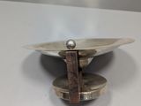 a metal object that is on top of a table