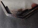 a close up of a piece of metal on a piece of cloth