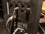 a close up of a speaker with wires attached to it