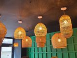 many lights hanging from the ceiling of a restaurant