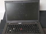 a laptop computer sitting on top of a black box