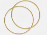 a pair of gold hoop earrings on a white background