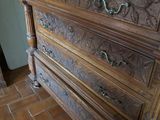 a dresser with a mirror on top of it in a room