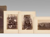 an old photo of a group of photographs of people in a field