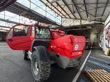 a red truck that is parked in a garage