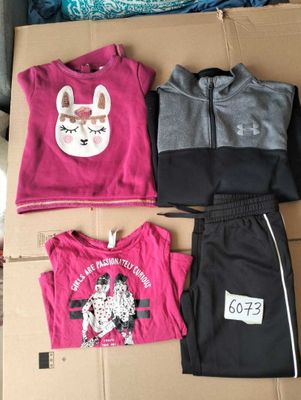 three pieces of clothing sitting on top of a cardboard box
