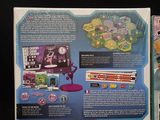 a back cover of a video game with a picture of an alien