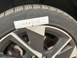 a close up of a tire with a measuring tape on it