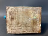 an image of a wooden box with writing on it sitting on a table