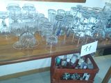 bottles and glasses on a table with a price tag on it