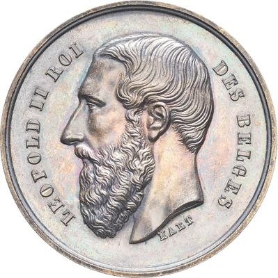 une vieille pièce de monnaie sur laquelle figure le visage d'un homme barbu