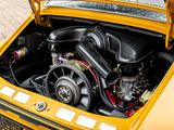 a yellow car with an engine in it ' s trunk