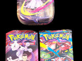 two packs of pokemon trading cards sitting on top of each other