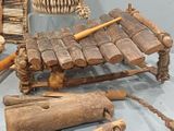 many different types of musical instruments displayed on the table