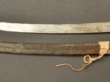 two old knives are laying on a table next to each other