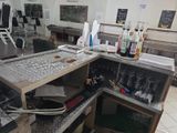 an image of a kitchen with a lot of bottles on the counter