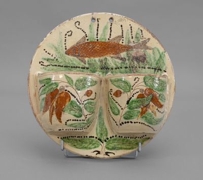 an image of a decorative plate with a fish on it