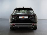 the rear end of a black car with a white background
