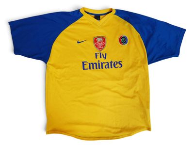 a close up of a yellow and blue soccer jersey