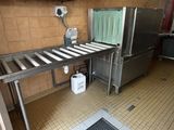 a kitchen with a sink and a metal counter