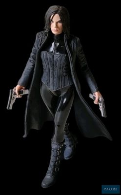 the action figure is dressed in a black outfit and holding two guns