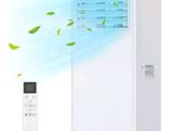 an image of a white air conditioner sitting next to a remote control
