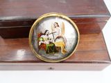 a small wooden box with a picture of a woman on it