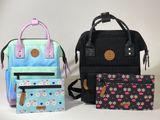 three bags sitting next to each other on a table