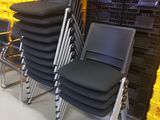a lot of chairs that are sitting in a room