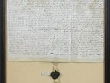 a black and white photograph of a piece of paper with writing on it