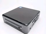 an image of a small computer sitting on top of a white surface