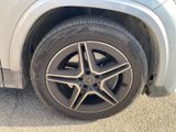 the tire of a car with a flat tire on the side of the road